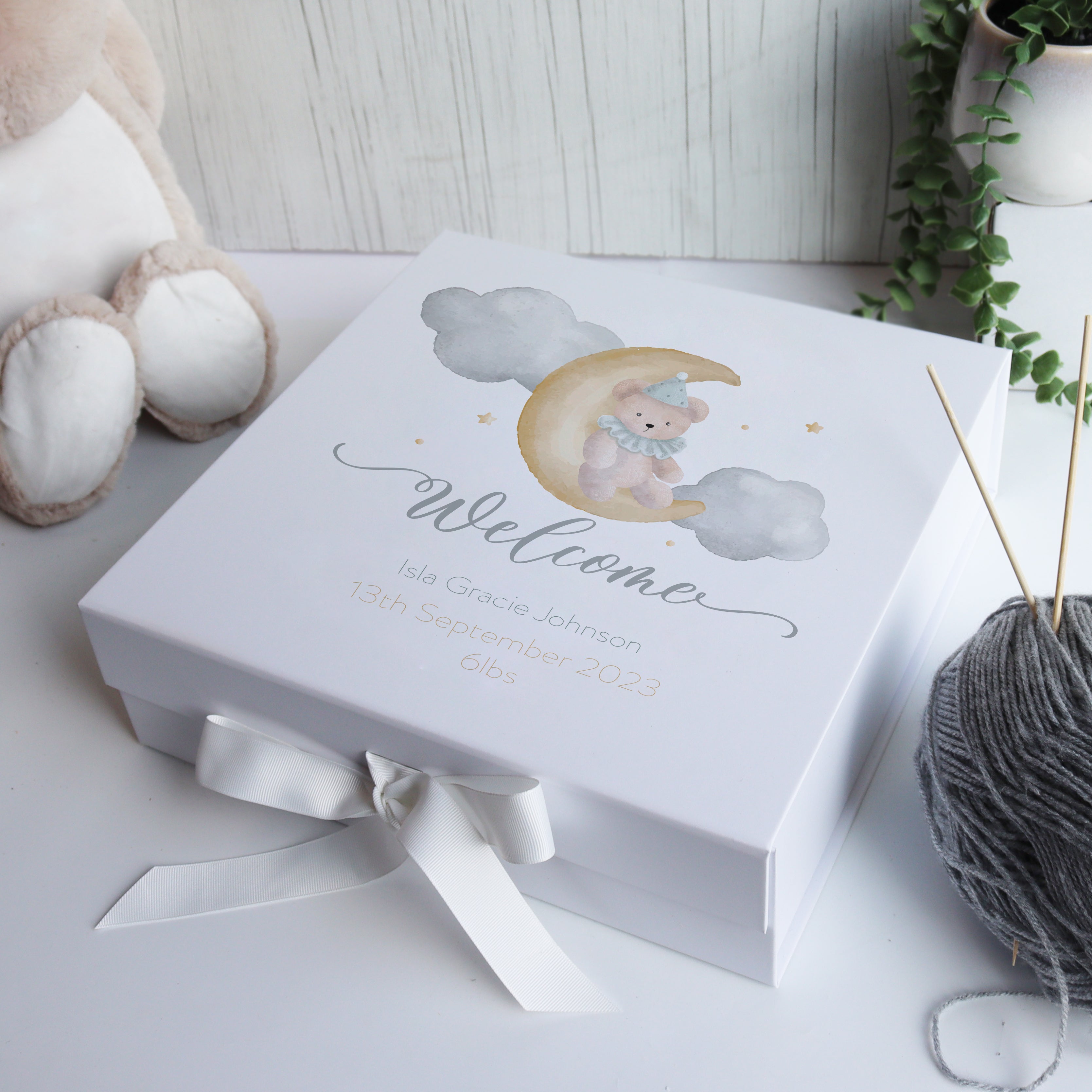 Personalised luxury baby memory box with matte white finish and ribbon, designed as a keepsake for a newborn baby