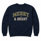 A navy blue crewneck sweatshirt featuring the text 'MERRY & BRIGHT' printed on the chest. The word 'MERRY' is in olive green varsity letters with a cream outline, and '& BRIGHT' is in cream varsity letters with an olive green outline, separated by a small cream star.