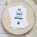 Funny birthday card reading 'Dad you still look 25 from a distance' with a cupcake