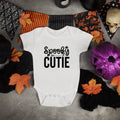 'Spooky Cutie' Halloween baby grow styled with bunting and pumpkins