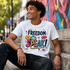 Man wearing a white Freedom To Speak t-shirt, sitting on steps in front of a colourful mural.