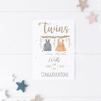 Hand-crafted personalised baby card featuring whimsical twin illustration.