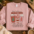 Pink Holiday Cheer coffee slogan Christmas sweatshirt laid flat with pine cones and a gift box