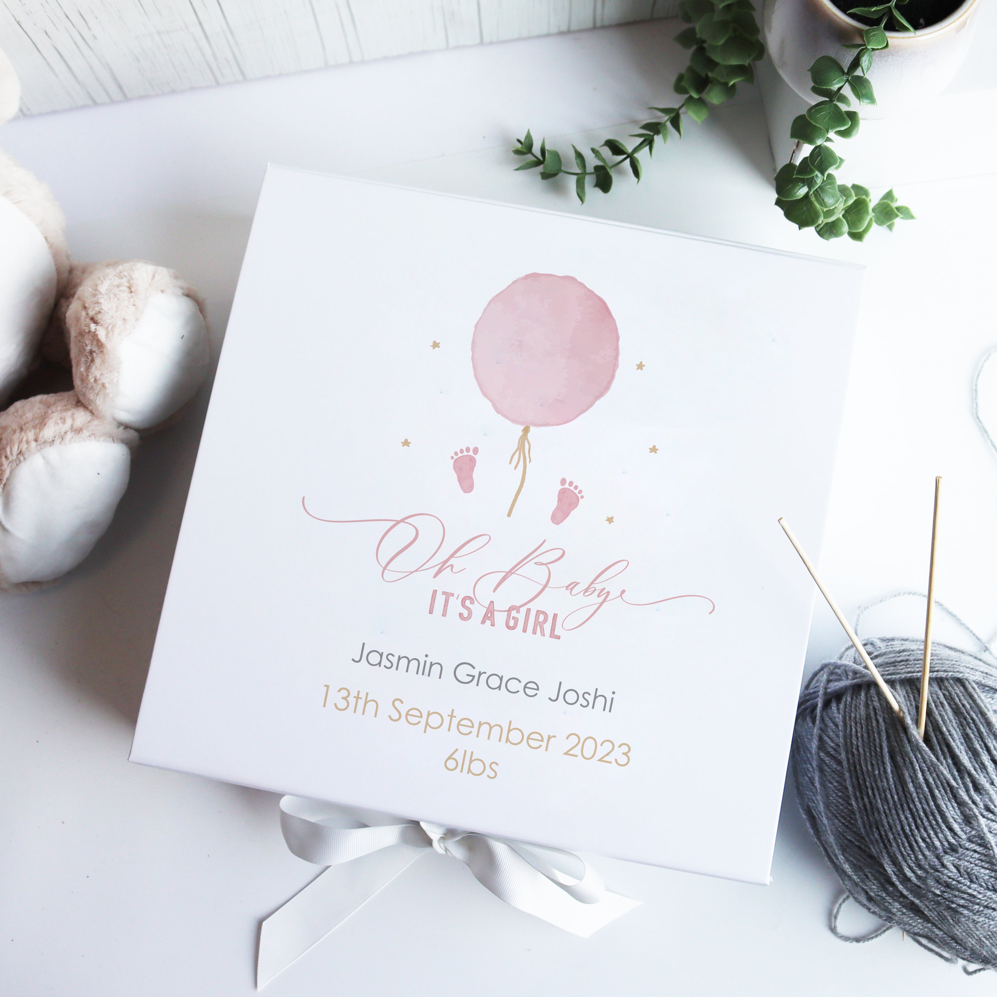 Personalised white luxury baby girl gift box with watercolour balloon design, customised with baby name, birth date, and weight.