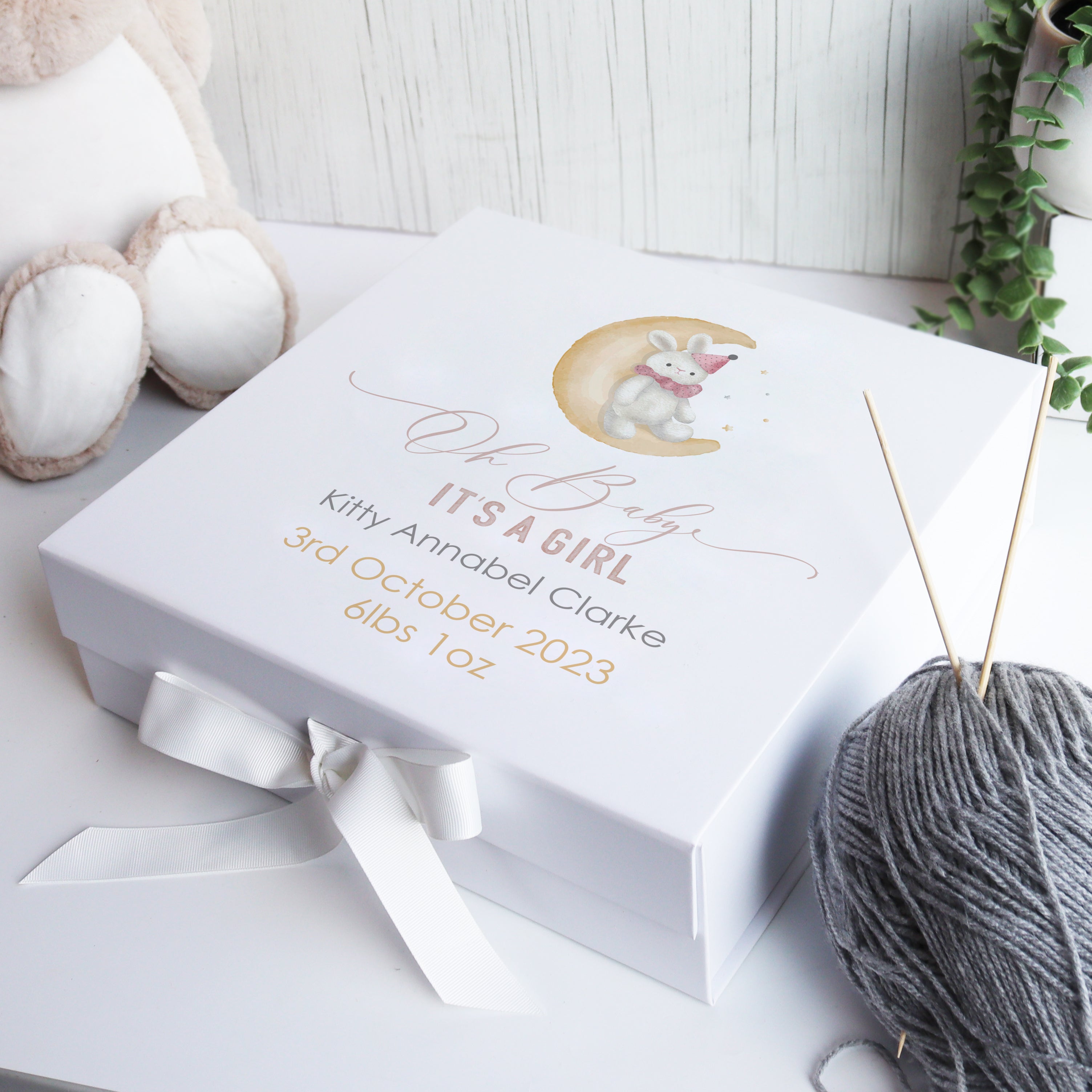 White luxury baby memory box with hand-drawn balloon illustration, designed as a personalised newborn keepsake gift.