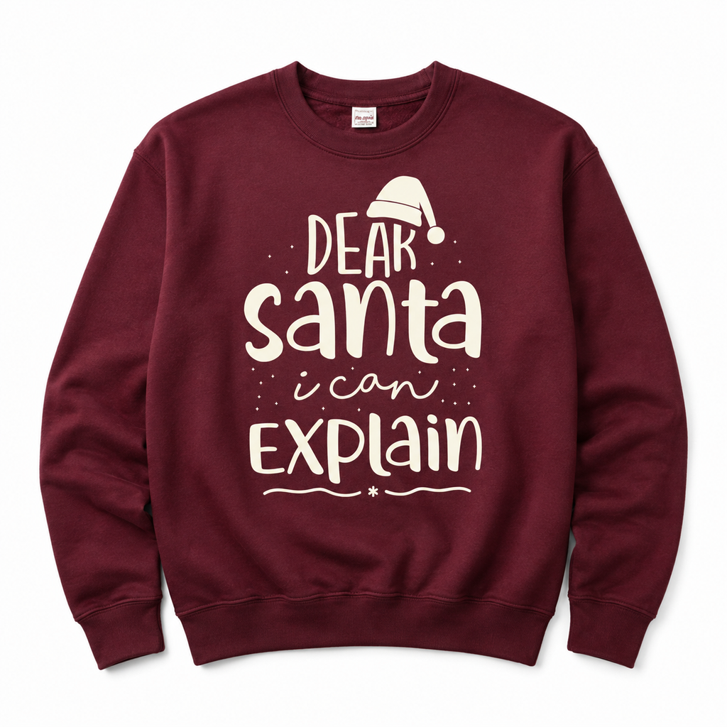 A maroon crewneck sweatshirt featuring a white graphic print that reads 'DEAR Santa i can EXPLAIN' with a small Santa hat illustration above the text, displayed on a clean white background.