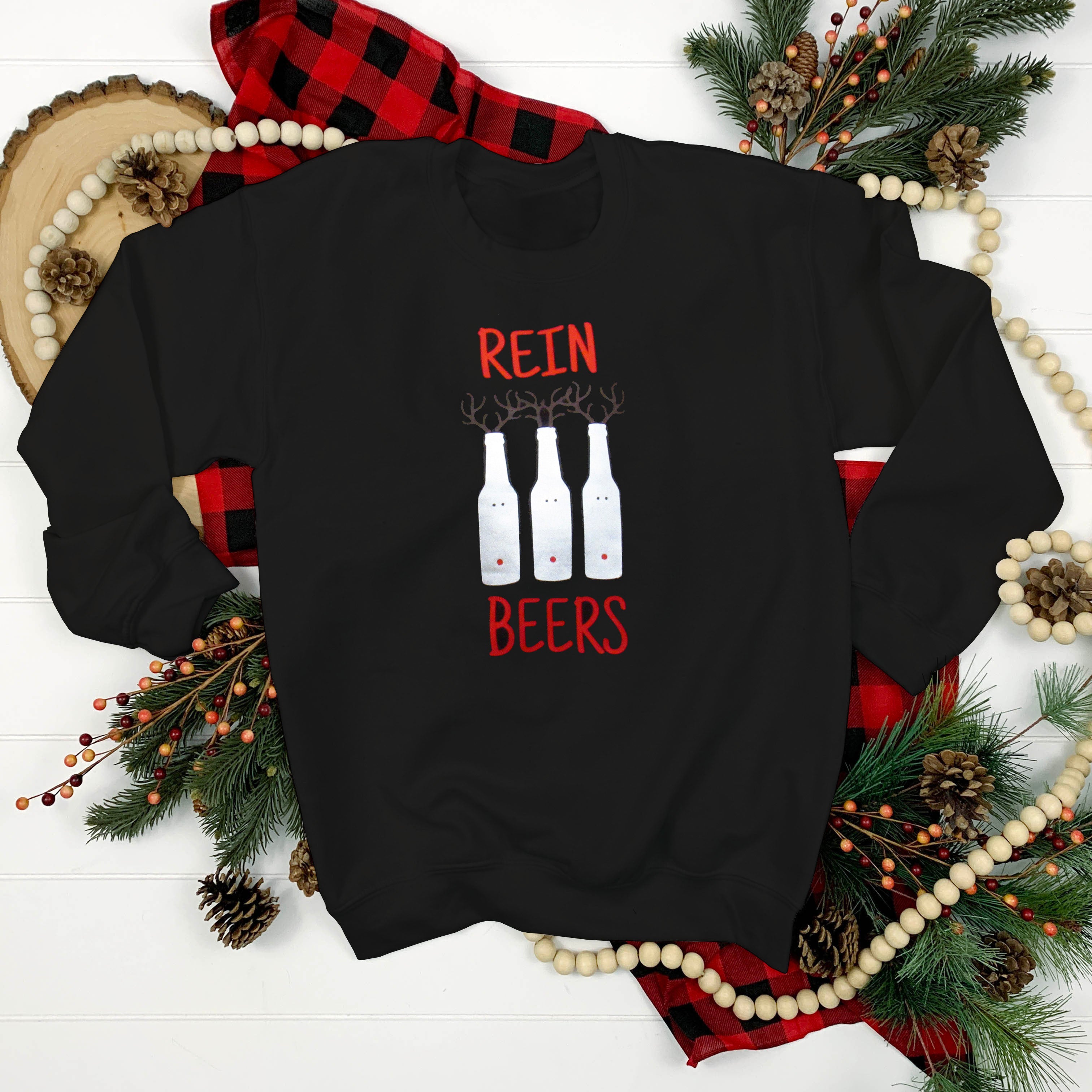 Cozy festive sweater featuring beer bottles dressed as reindeer