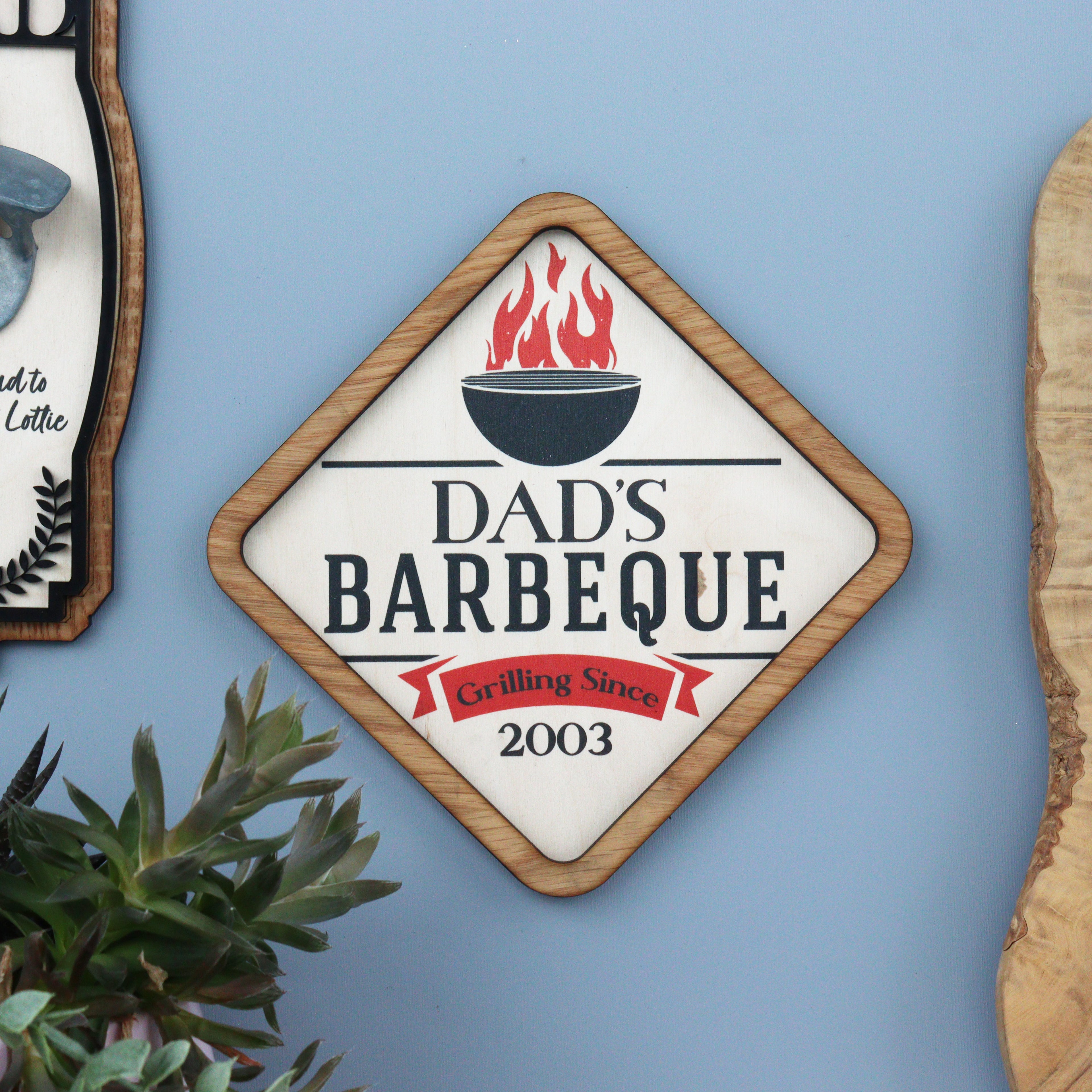 Custom Dad BBQ sign hanging in garden
