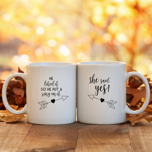 Engagement couples mug set with playful arrow and heart text, styled for a gift