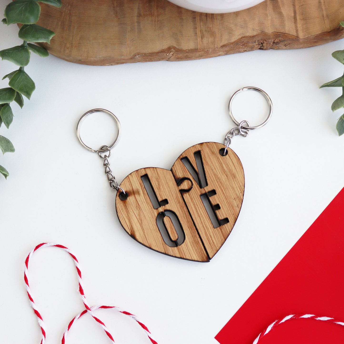 LOVE wooden valentines keyring set that has LO on one side of the split heart and VE on the other shown together as one heart
