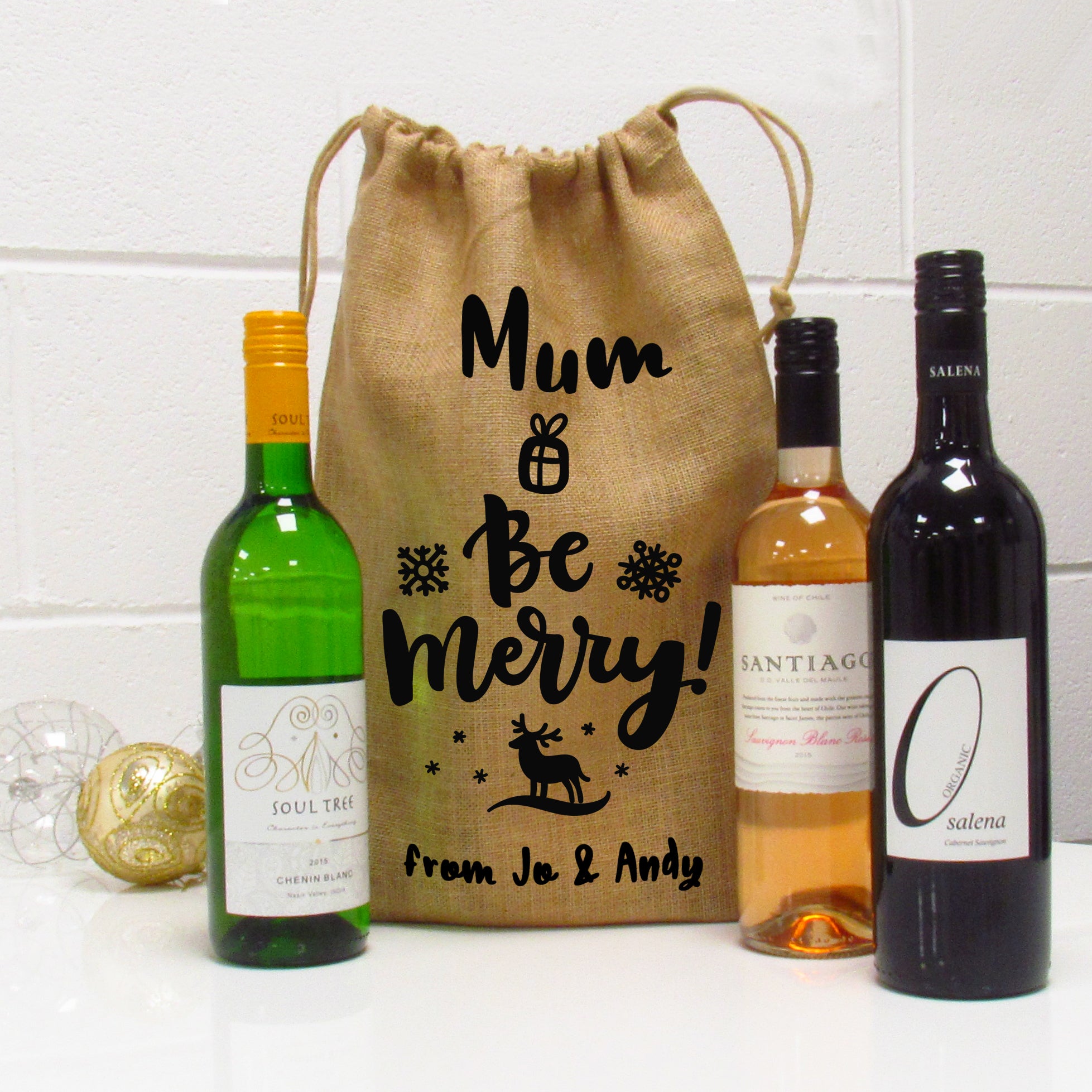 Festive wine gift bag with stags and snowflakes personalised