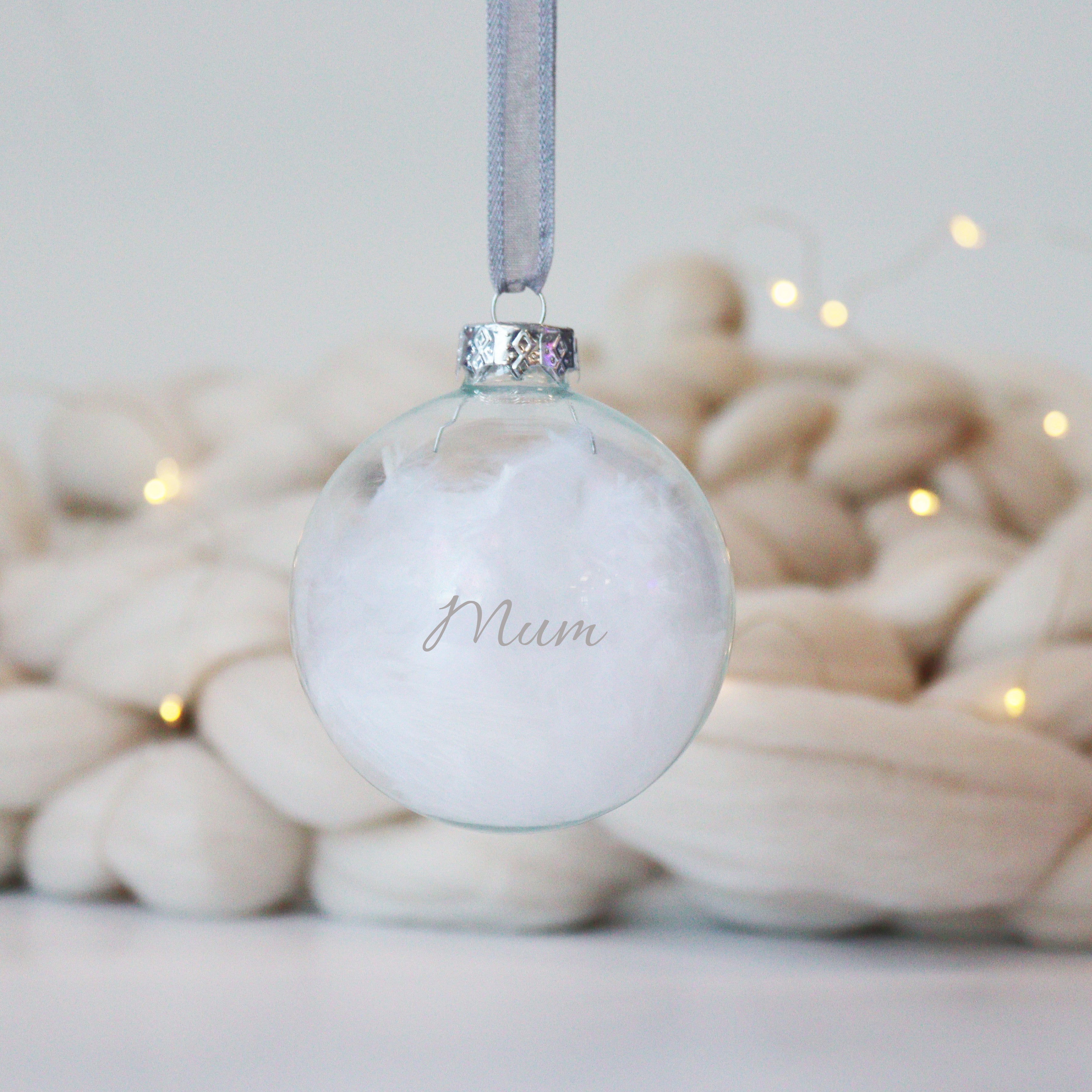 Personalised memorial feather glass bauble with silver name print