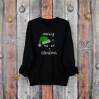 Black Christmas jumper with a cat in a santa hat