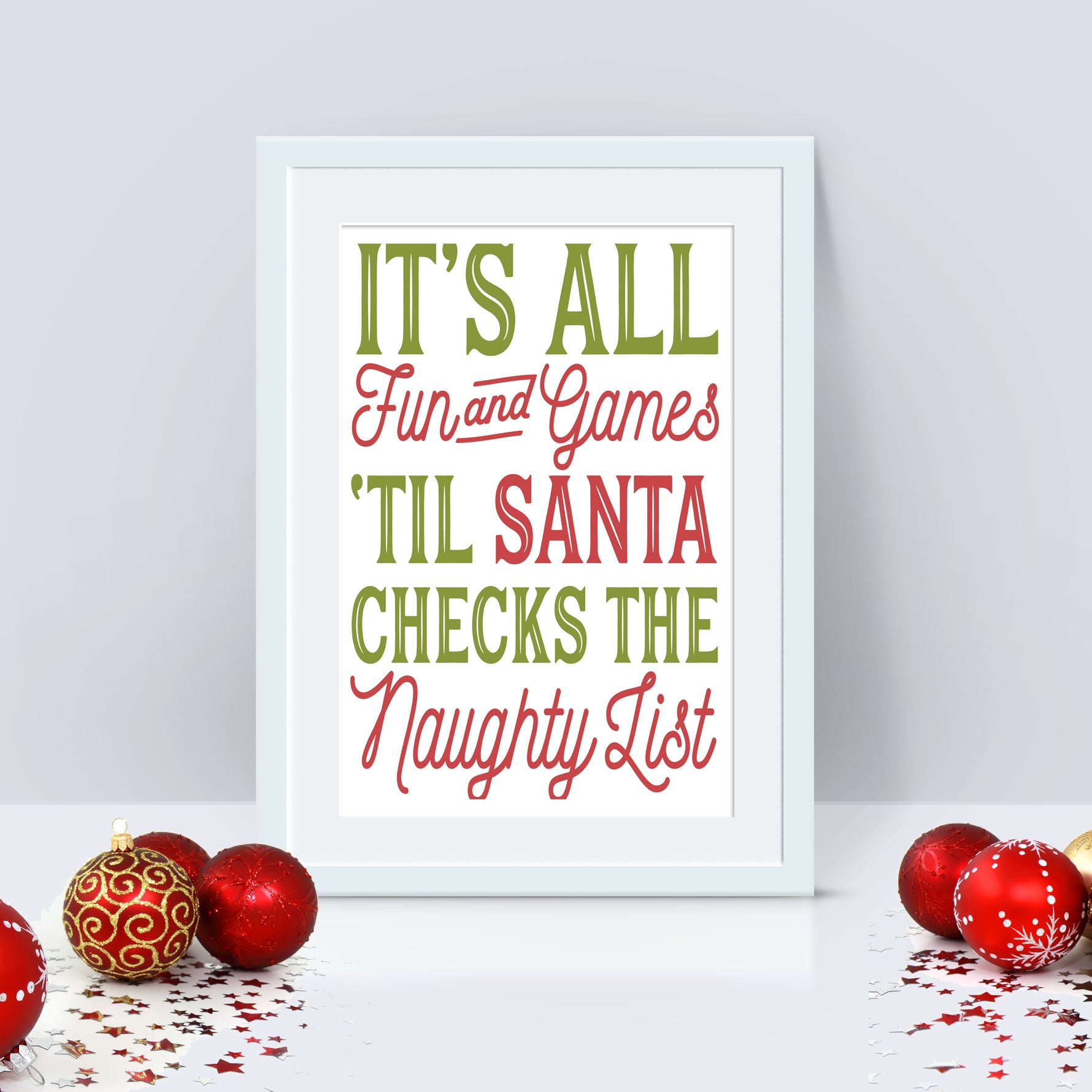 A colorful Christmas-themed print with the phrase 'It's all fun and games 'til Santa checks the naughty list' on a white background, surrounded by Christmas decorations.