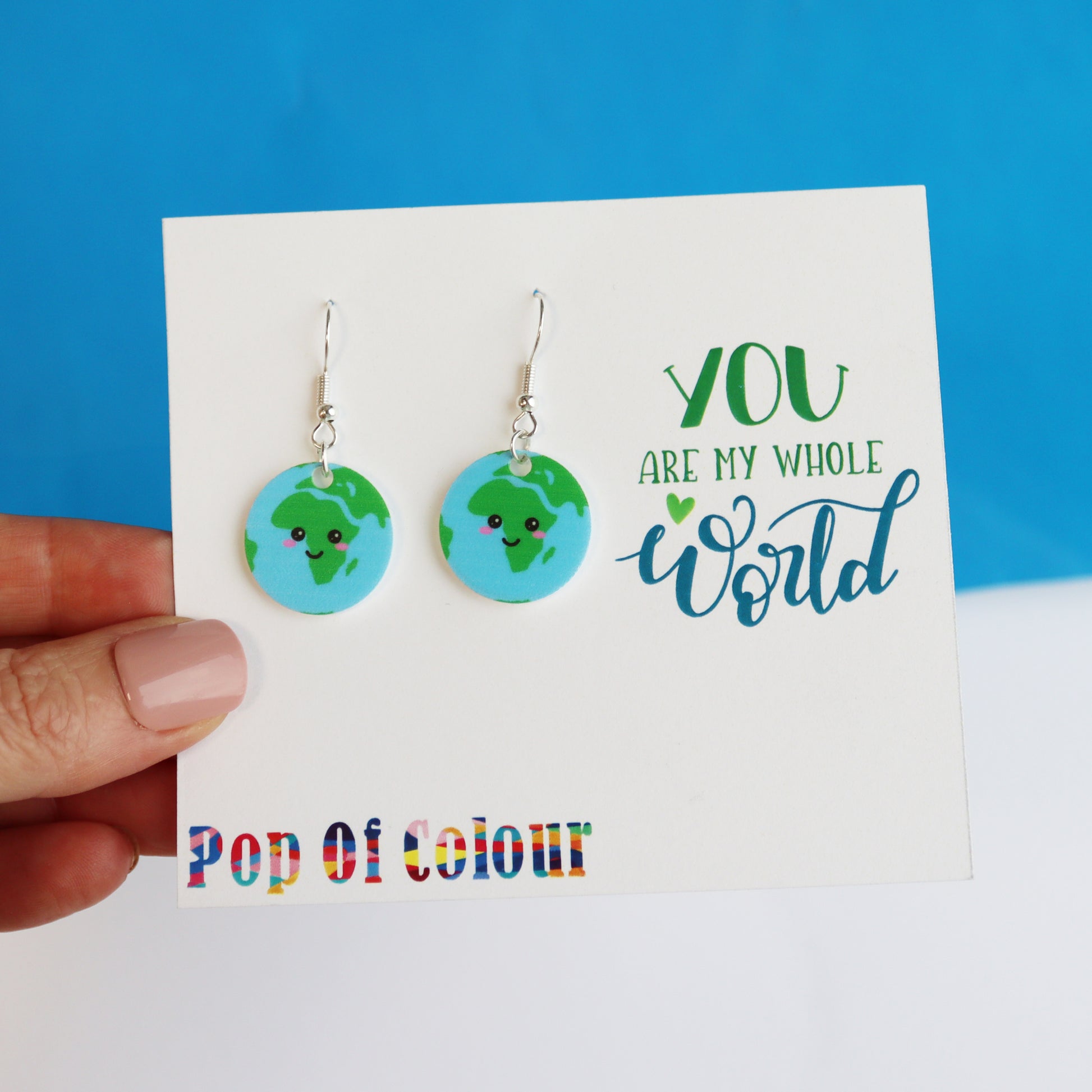 You are my whole world fun kawaii based earth earrings shown on earring backing card with the logo Pop of Colour printed