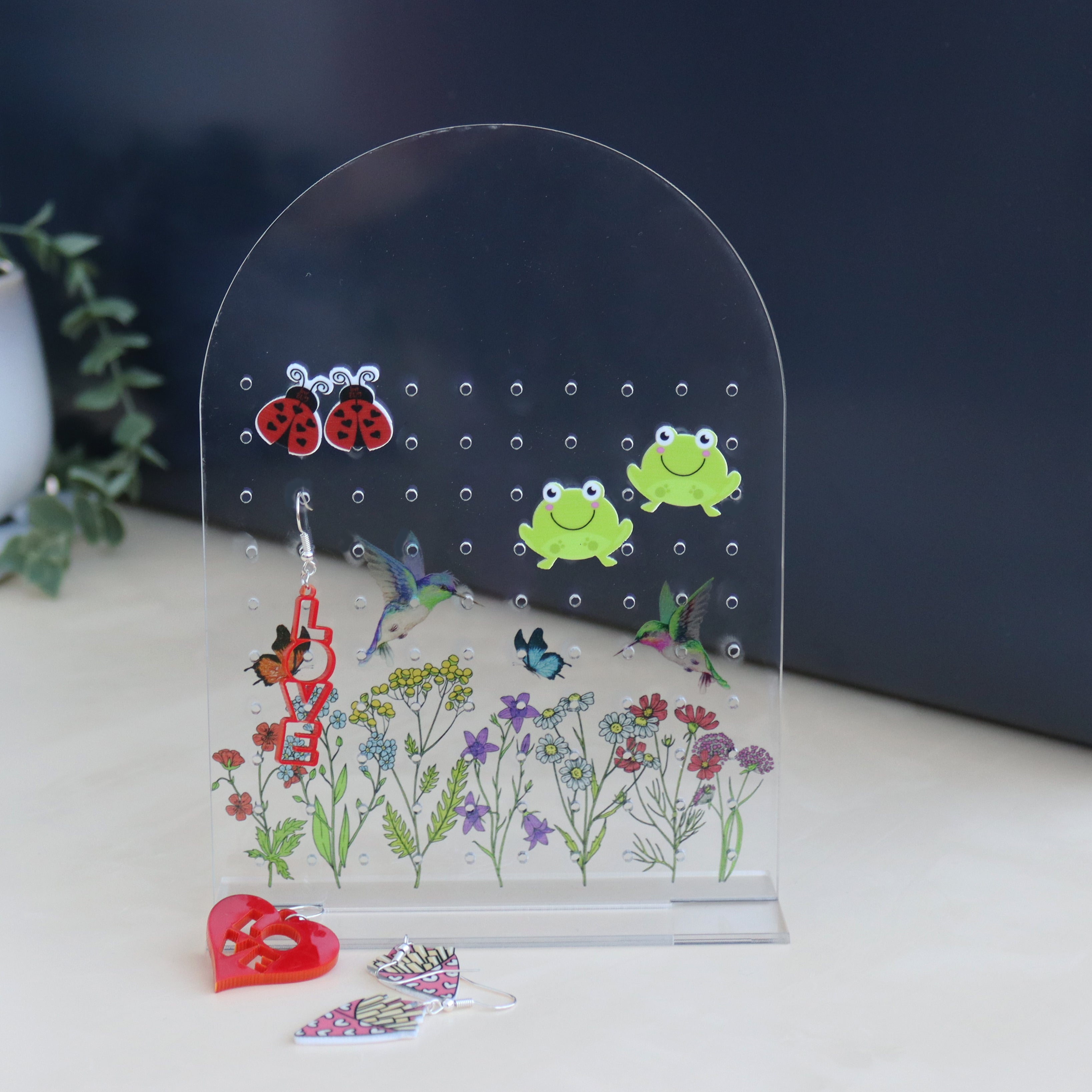 acrylic wildflower printed earrings shown from a different angle with personalisation as mum's earrings