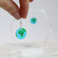 acrylic earrings printed with a kawaii earth
