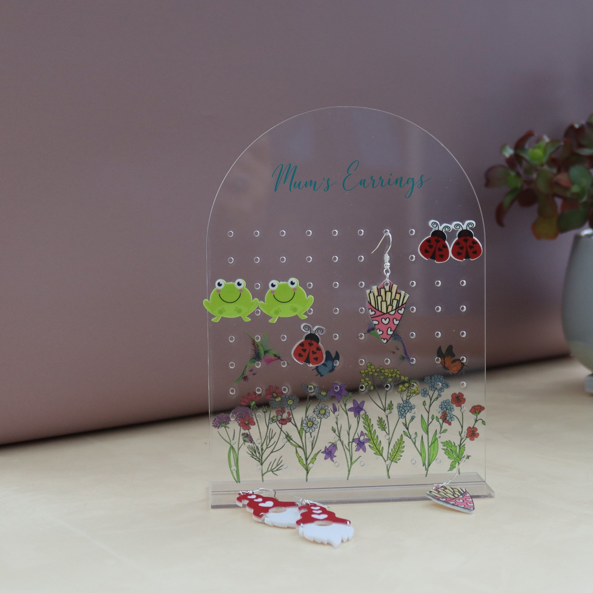 amira&#39;s earring personalised acrylic earring holder with pretty wildflower scence printed onto the earring holder