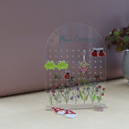 amira's earring personalised acrylic earring holder with pretty wildflower scence printed onto the earring holder
