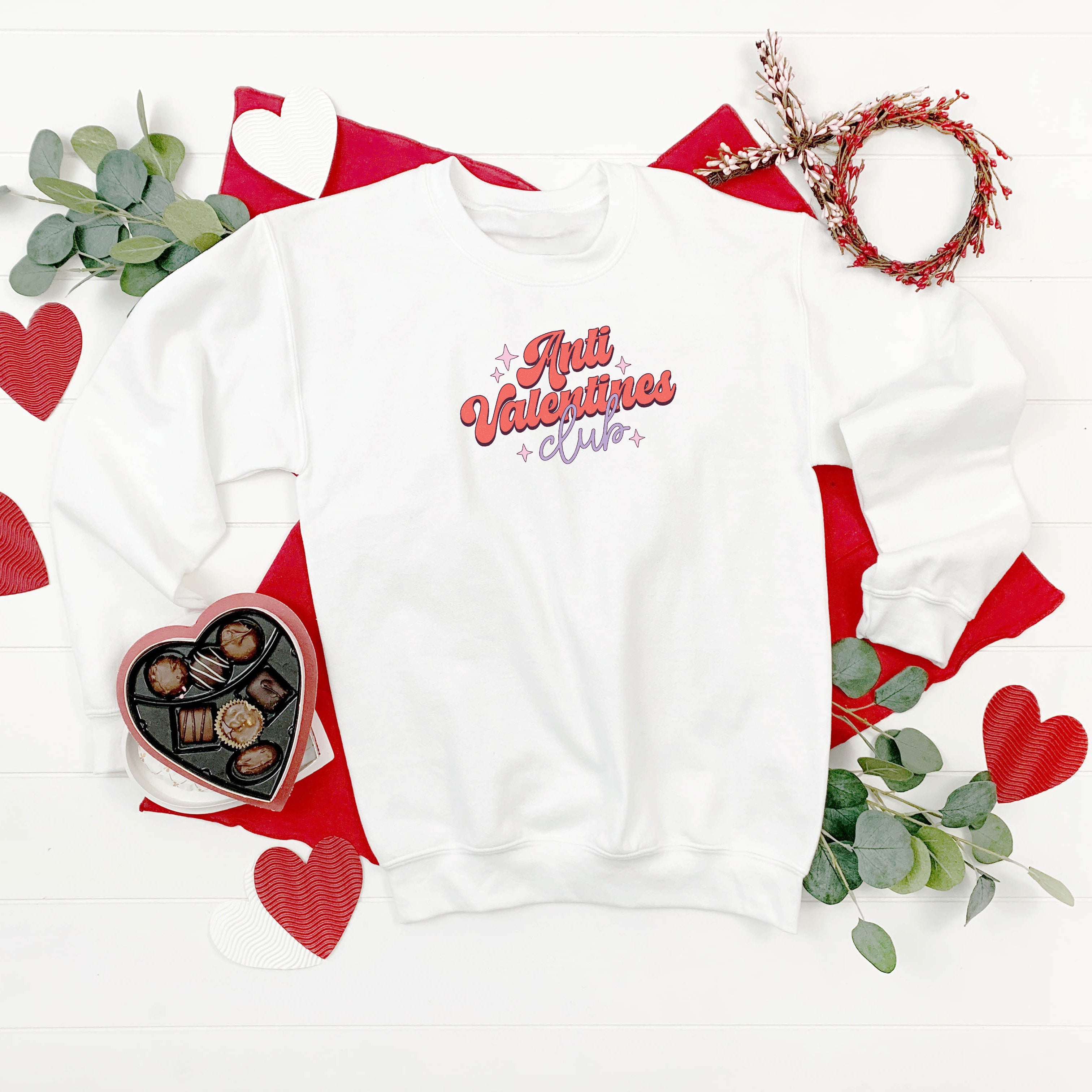 Anti Valentine's white jumper with retro print modelled with jeans