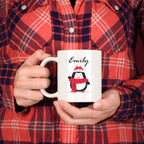 Personalised Christmas mug with festive character design and custom name, available in red or green colour options