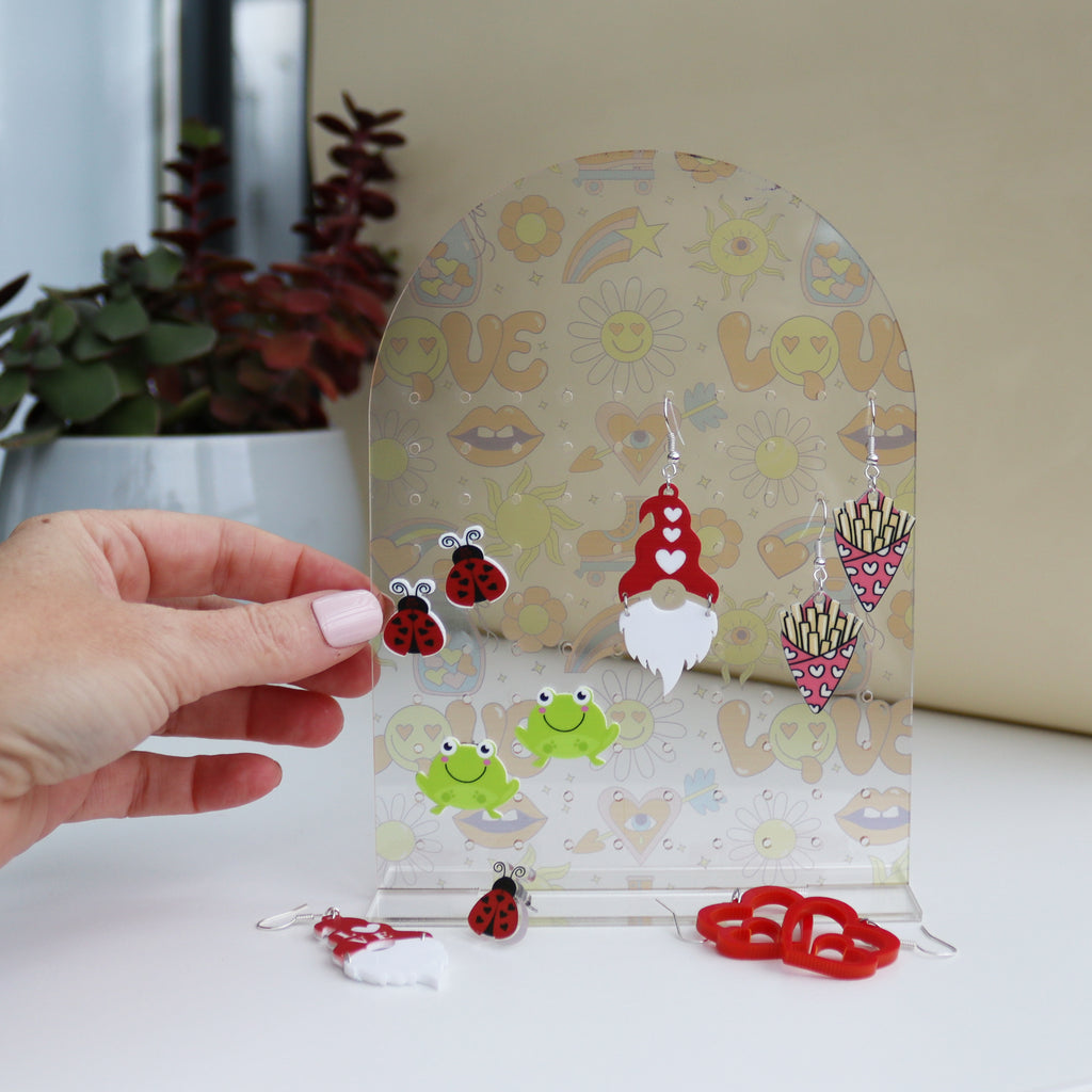 close up of acrylic earring holder showing the size of the holder can hold up to 50 pairs of earringsclose up of acrylic earring holder showing the size of the holder can hold up to 50 pairs of earrings