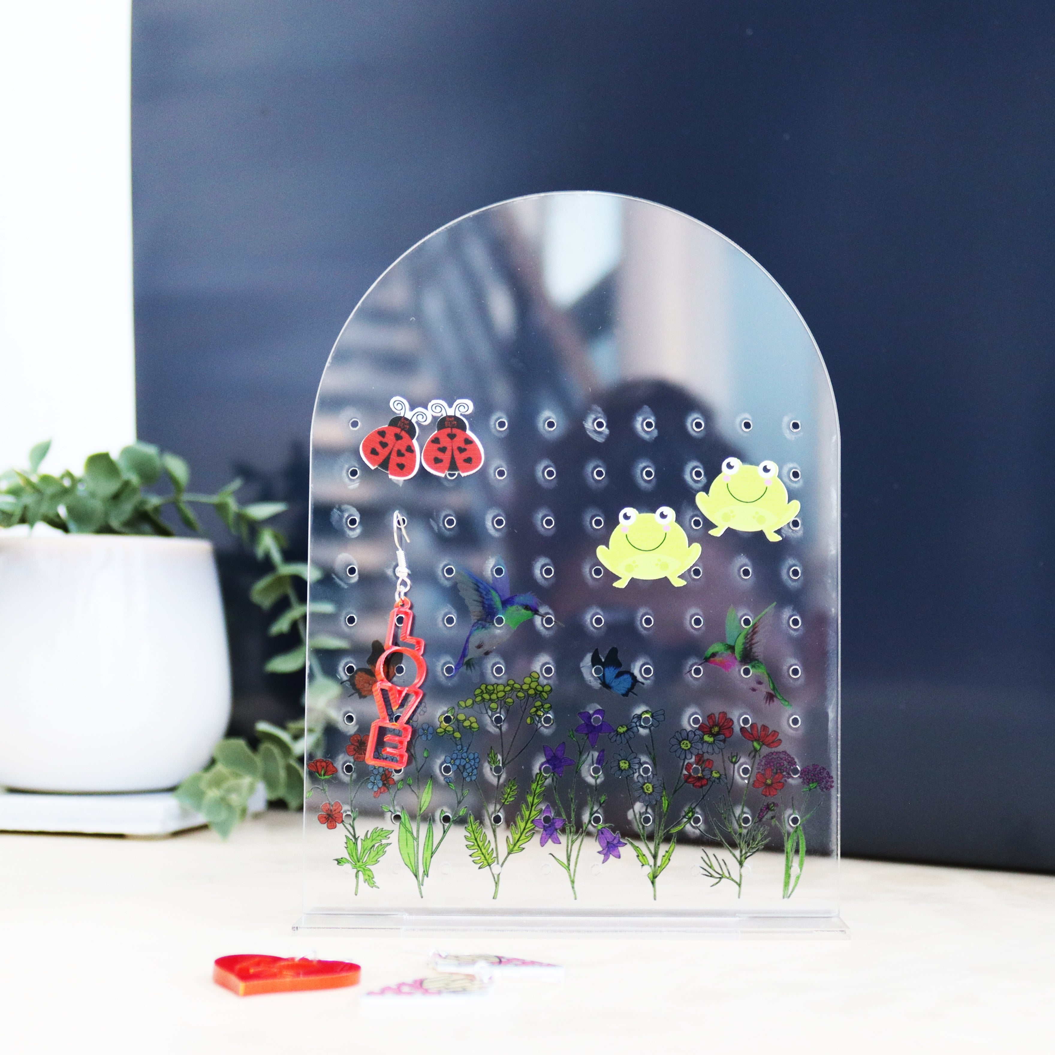 acrylic wildflower printed earrings shown from a different angle with personalisation as mum's earrings