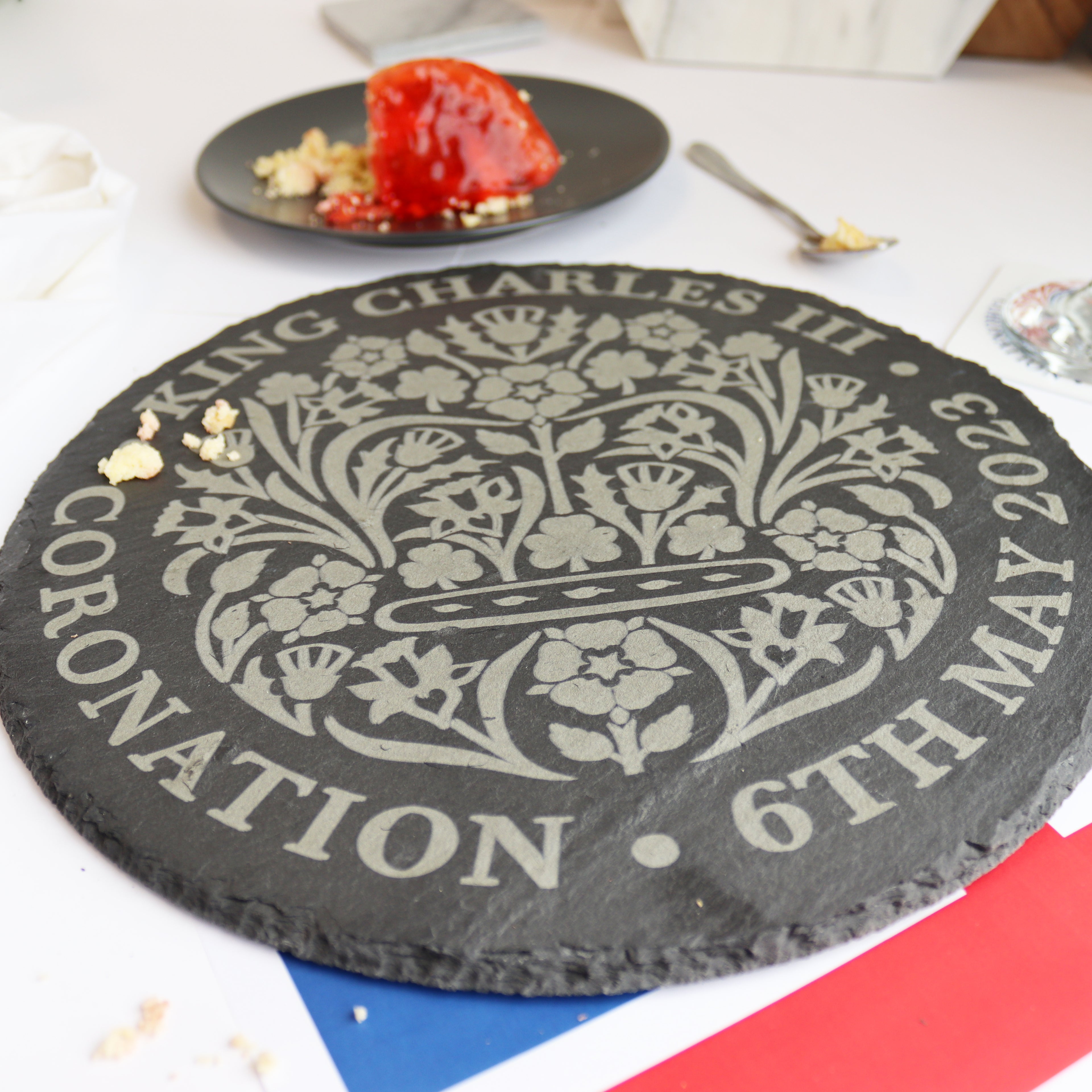 close up of slate cake platter for king charles iii coronation