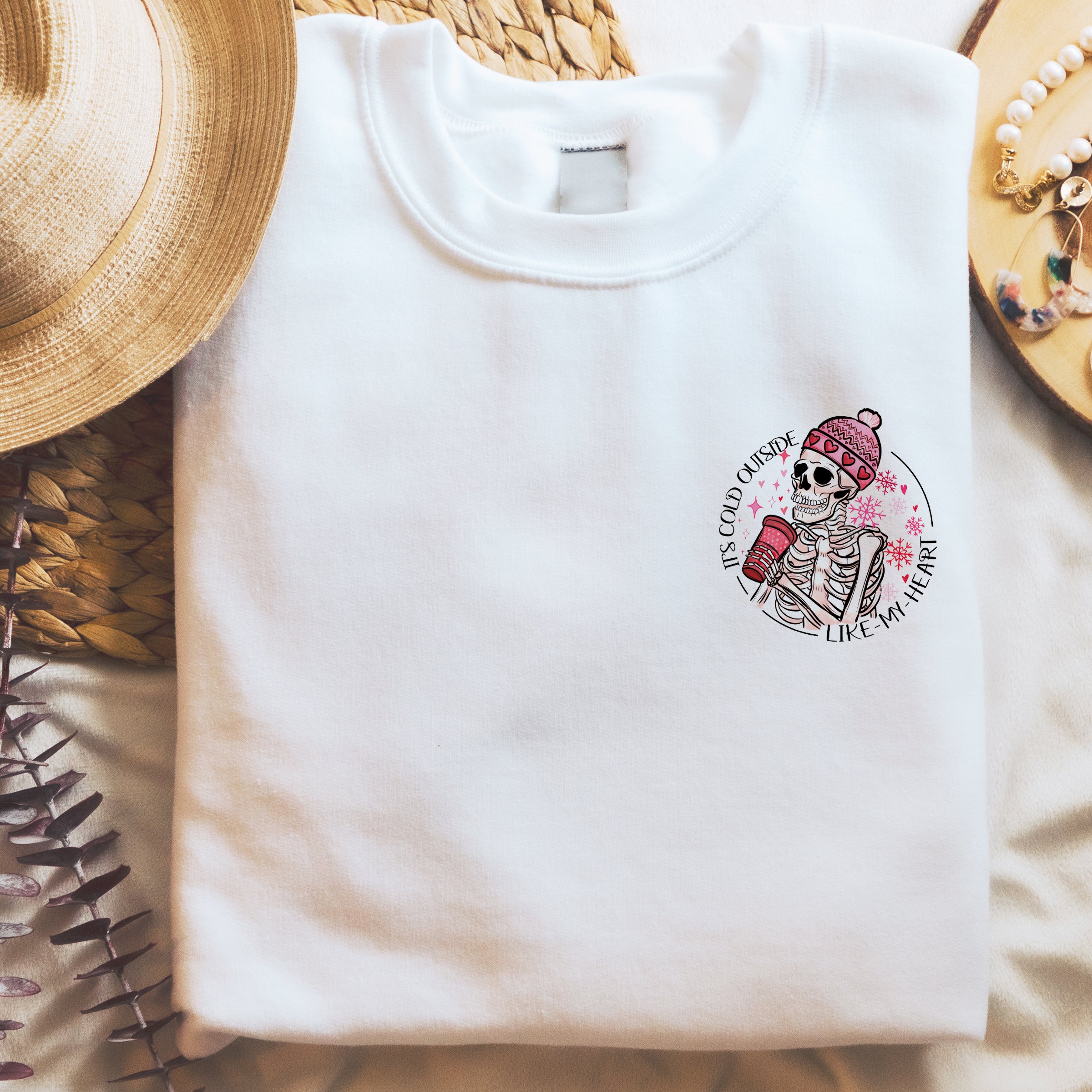 Soft white vegan sweatshirt with Winter skeleton design cold like my heart