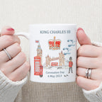 commemorative white mug with painted London scene and crown for King Charles III coronation