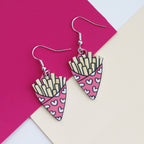 fries before guys earrings cut from acrylic and printed with a bag of chips design the bag of chips is pink and has hearts printed on it