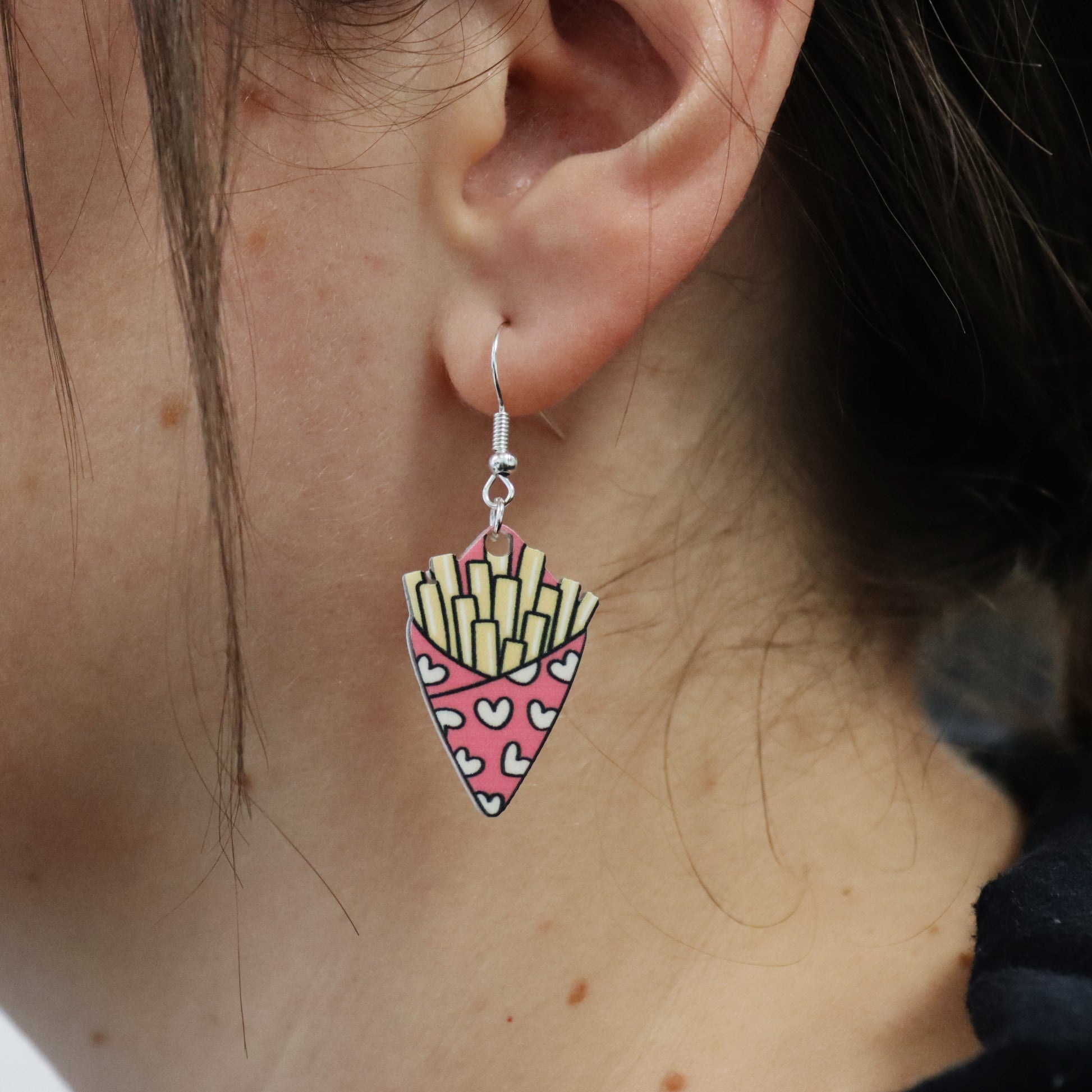 fries before guys valentine&#39;s earring shown in an ear for size reference