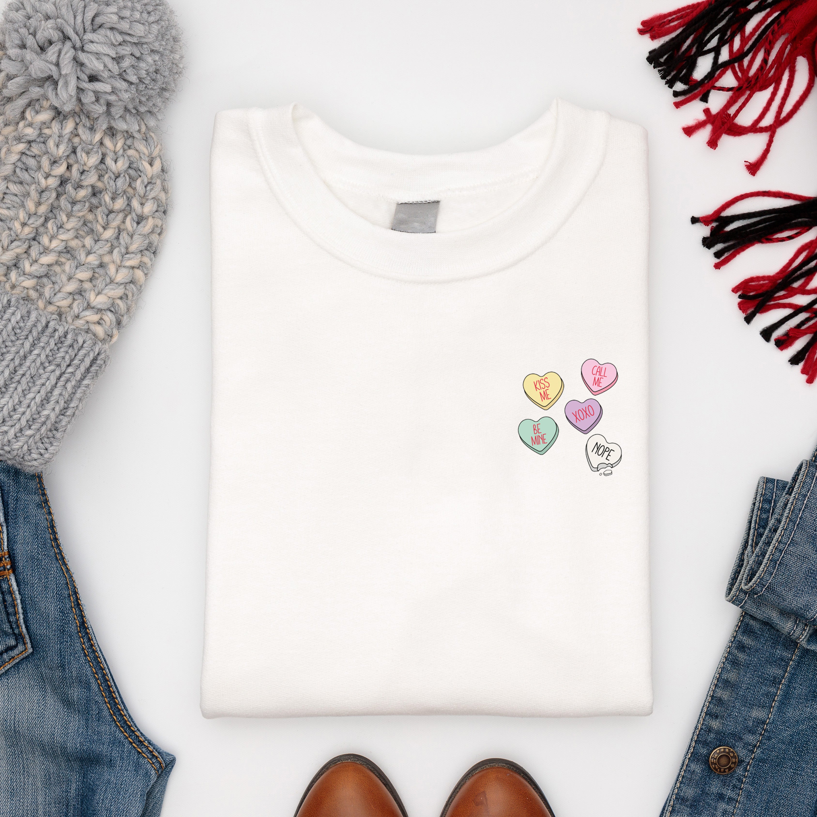 Women's Valentine's sweatshirt with love hearts sweets design paired with Jeans