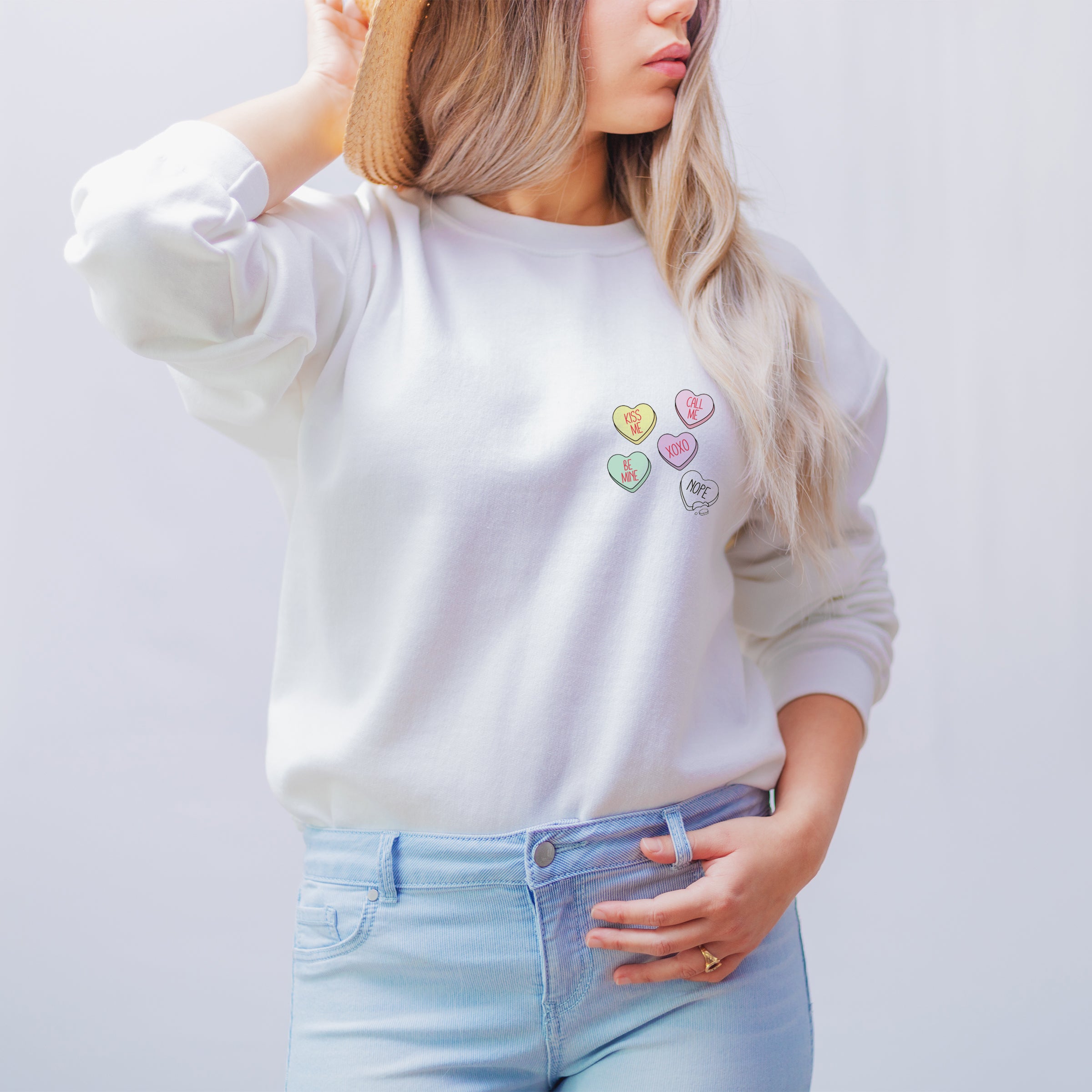 White sweatshirt with love heart sweets design for Anti Valentine's
