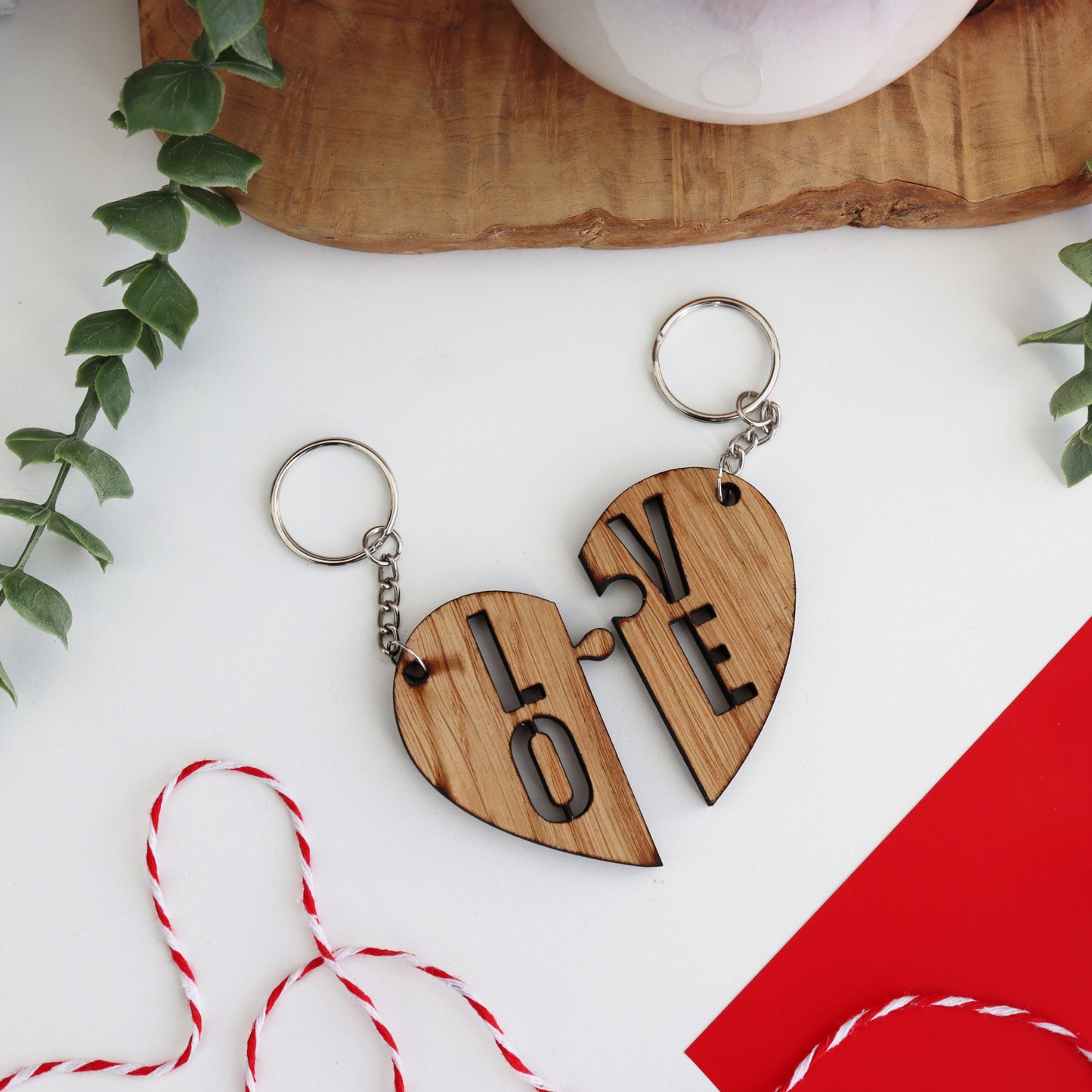 heart keyring split into with LOVE written between the two couples keyring set wooden couples keyring