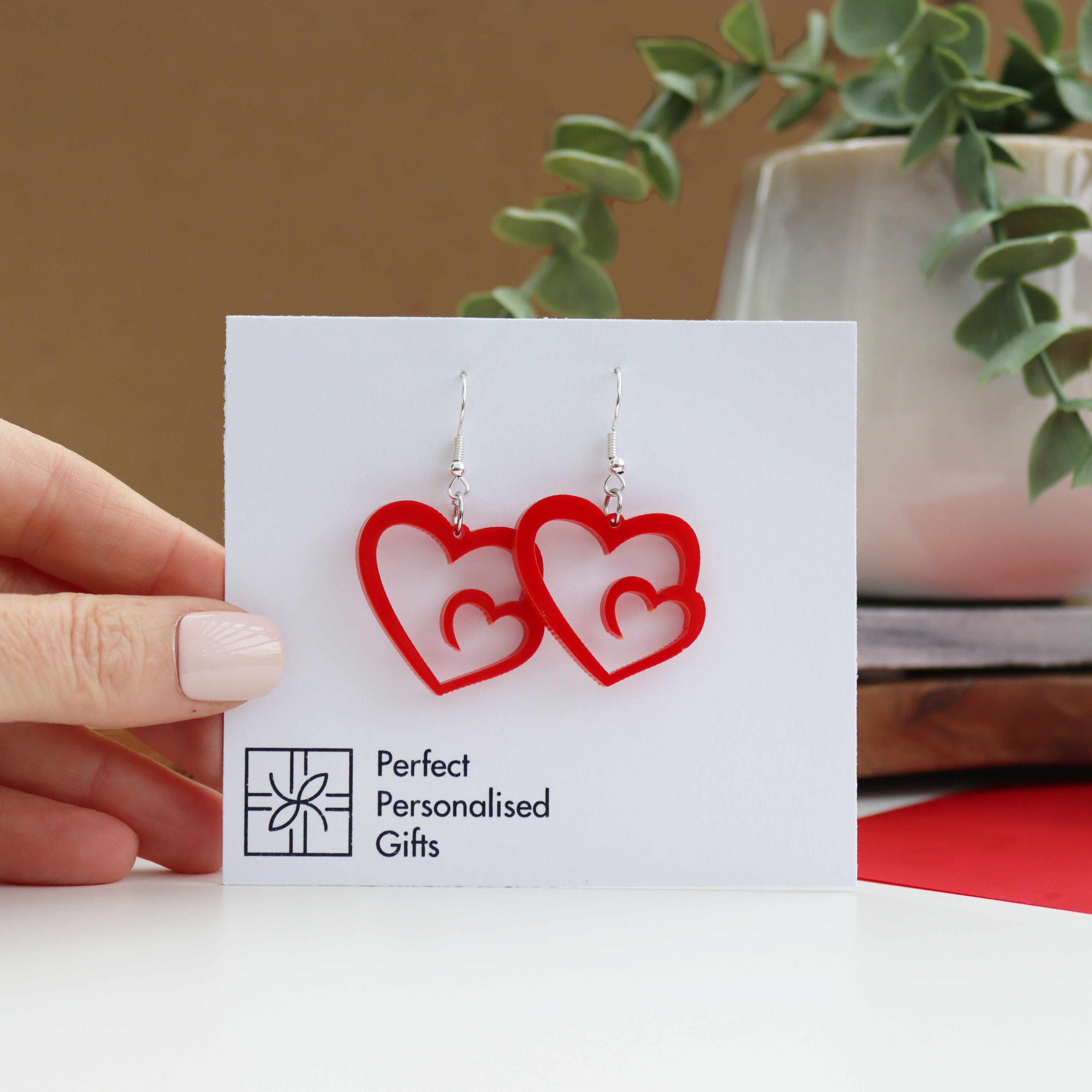 heart swirl laser cut red acrylic valentines earrings dagly earrings with a swirl heart