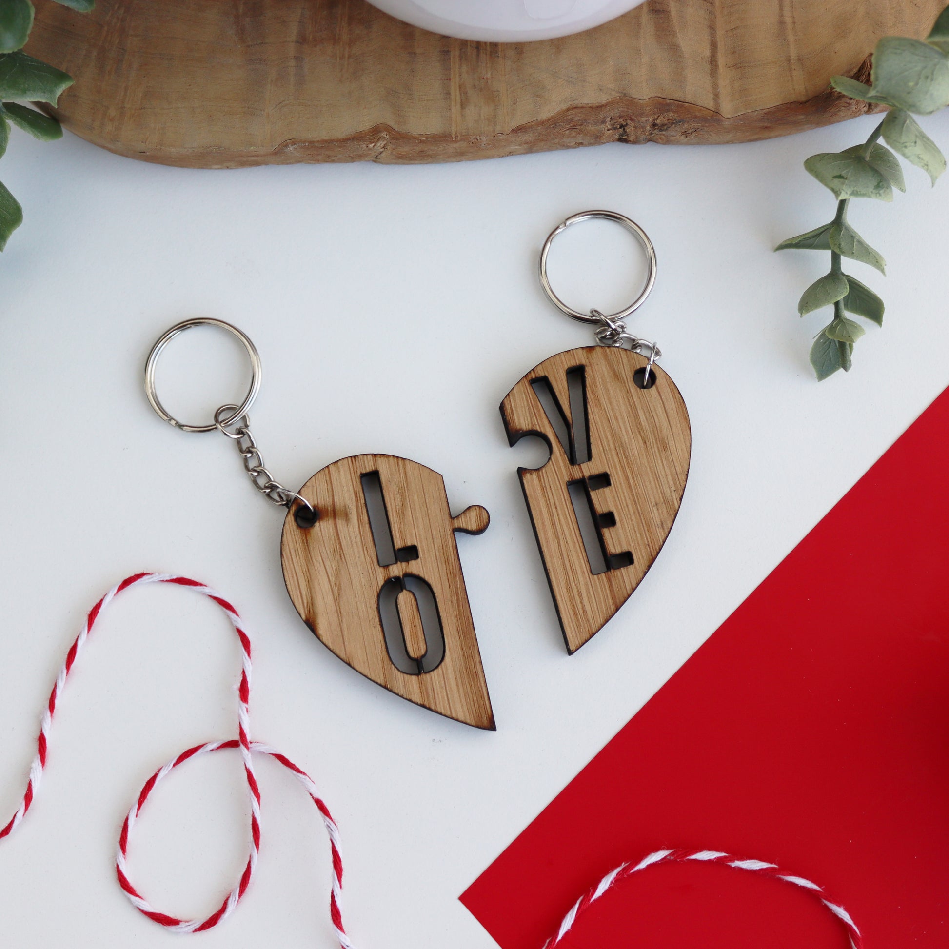 heart wooden valentines keyring set that has LO on one side of the split heart and VE on the other