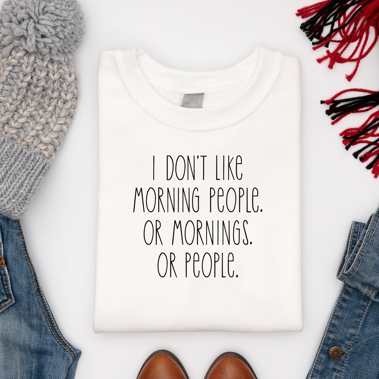 Comfy soft white jumper with funny slogan paired with winter woollies