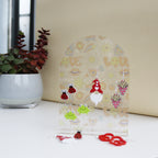 front view of acrylic earring holder with soft funky love print