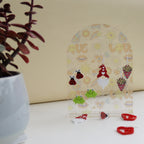 side on view of acrylic earring holder with love funky print