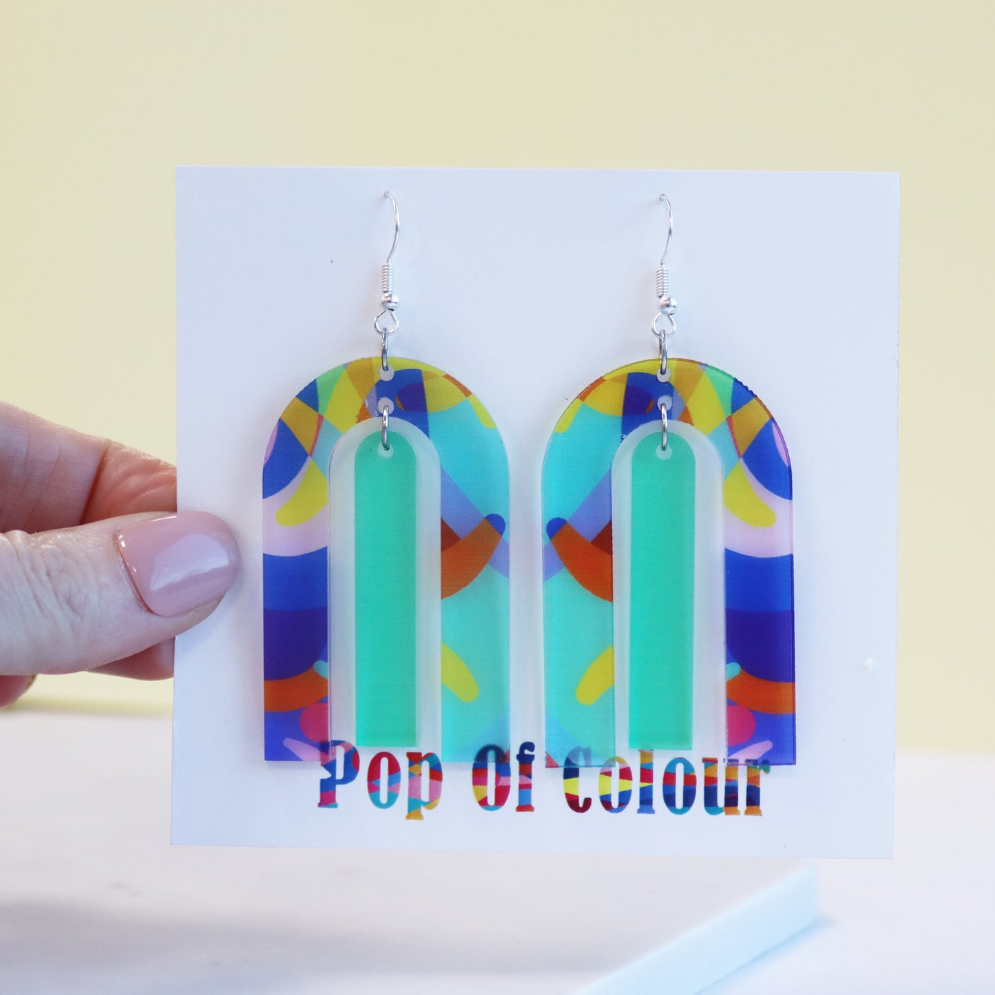 modern large arch shape geometric shape printed acrylic statement earrings shown on backing card