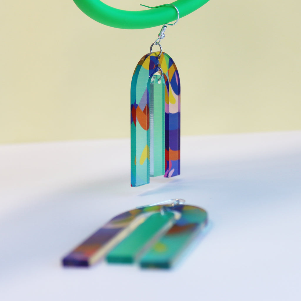modern large arch shape geometric shape printed acrylic statement earrings shown on hanging