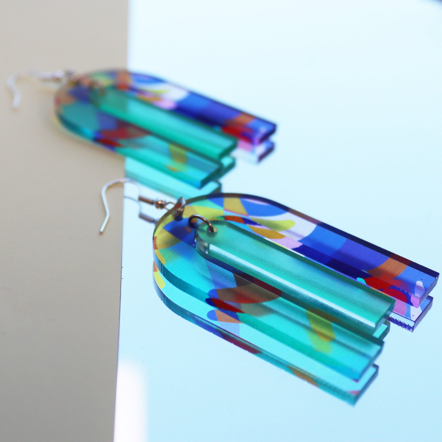modern large arch shape geometric shape printed acrylic statement earrings shown on backing card