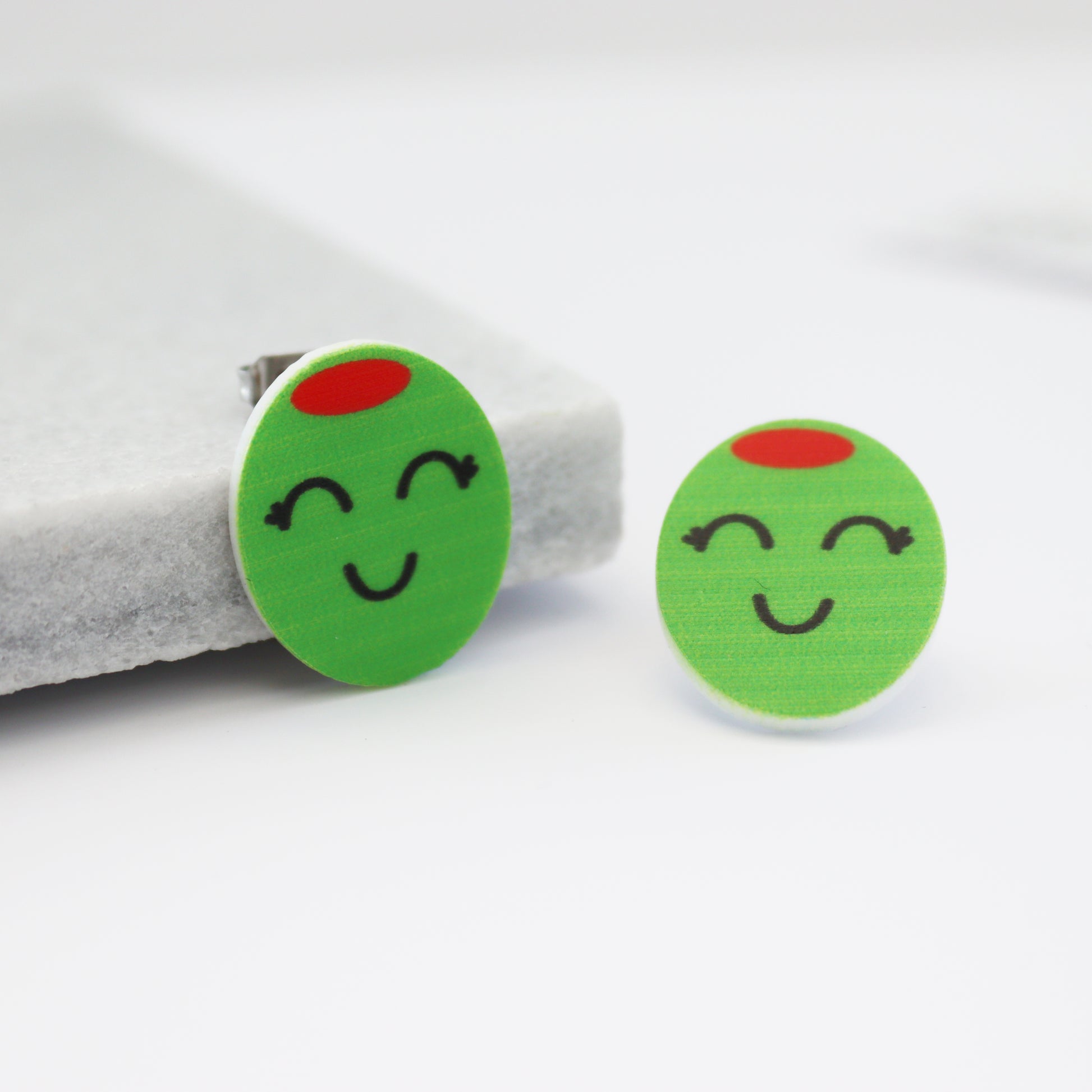 olive you stud olive earrings on marble