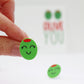 olive you stud olive earrings on paper background
