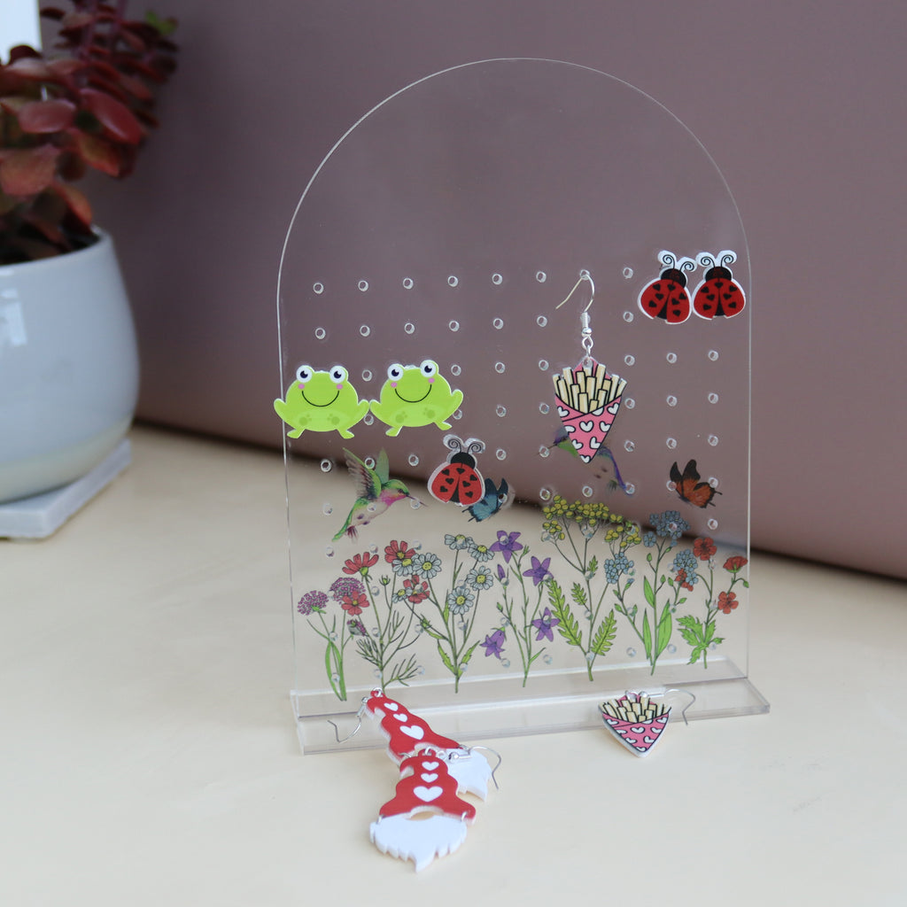 amira's earring personalised acrylic earring holder with pretty wildflower scence printed onto the earring holder
