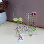 amira's earring personalised acrylic earring holder with pretty wildflower scence printed onto the earring holder