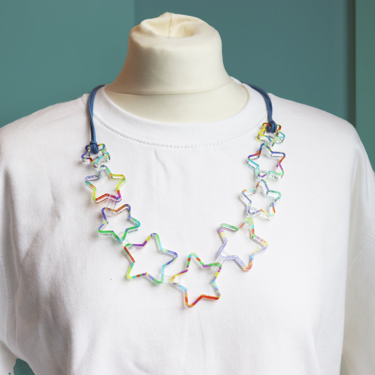 printed star acrylic clear necklace statement fashion jewellery on white jumper