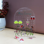 amira's earring personalised acrylic earring holder with pretty wildflower scence printed onto the earring holder