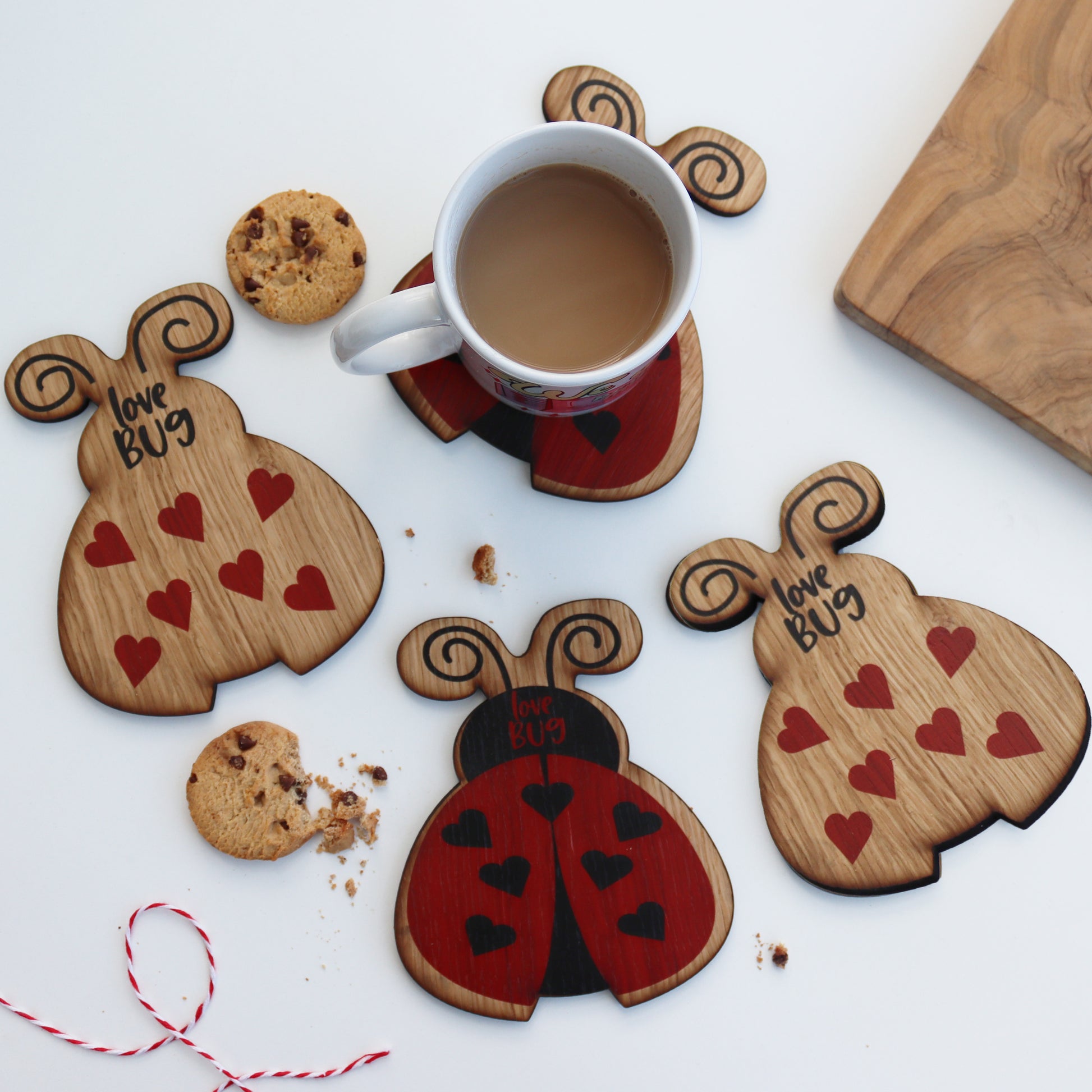 set of 4 wooden ladybird coasters 2 with a printed love bug and 2 with hearts